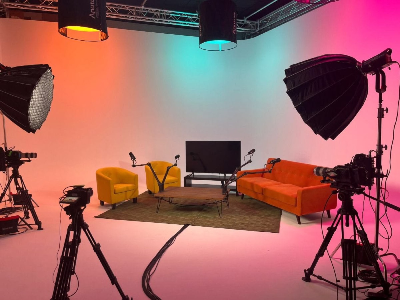 Film studio with cameras, softboxes and set